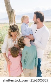 Family Of 5 With A Mom And Dad. There Are Only Boy Children, 3 Of Them. Everyone Is Happy.