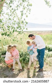 Family Of 5 With A Mom And Dad. There Are Only Boy Children, 3 Of Them. Everyone Is Happy.