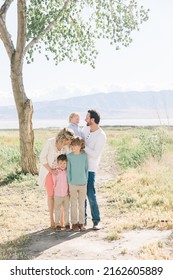 Family Of 5 With A Mom And Dad. There Are Only Boy Children, 3 Of Them. Everyone Is Happy.