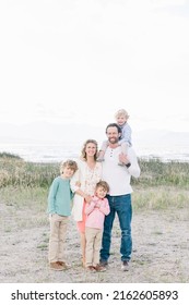 Family Of 5 With A Mom And Dad. There Are Only Boy Children, 3 Of Them. Everyone Is Happy.