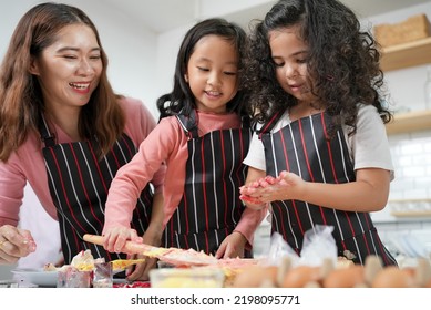 Family Activities Make A Cake In The Kitchenfamily Activities Make A Cake In The Kitchen, Child Making Cake With Family. Family Fun Together In Kitchen. Kitchen Activities Concept.