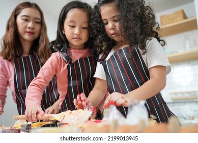 Family Activities Make A Cake In The Kitchenfamily Activities Make A Cake In The Kitchen, Child Making Cake With Family. Family Fun Together In Kitchen. Kitchen Activities Concept.