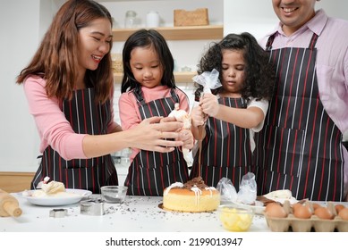 Family Activities Make A Cake In The Kitchenfamily Activities Make A Cake In The Kitchen, Child Making Cake With Family. Family Fun Together In Kitchen. Kitchen Activities Concept.