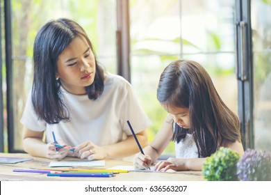 Family activity mother and kid drawing the pictures, hobby between mom and child, making a closely relationship with family, I love Mom, I love you Mom - Shutterstock ID 636563207