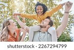 Family, adoption and piggyback in the park with a girl and foster parents having fun together in the park. Diversity, playful and freedom with a mother, father and daughter bonding outdoor in nature