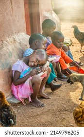 Family Of African Kids In The Village Eating