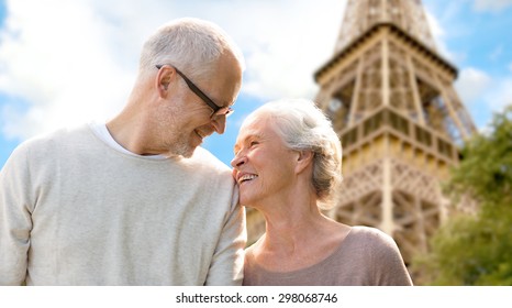 Family, Age, Tourism, Travel And People Concept - Happy Senior Couple Over Paris Eiffel Tower In France