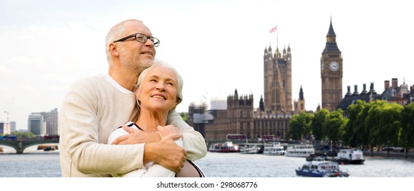 Family, Age, Tourism, Travel And People Concept - Happy Senior Couple Over Houses Of Parliament Or Palace Of Westminster And Big Ben Clock Tower In London