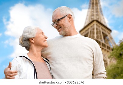 Family, Age, Tourism, Travel And People Concept - Happy Senior Couple Over Paris Eiffel Tower In France