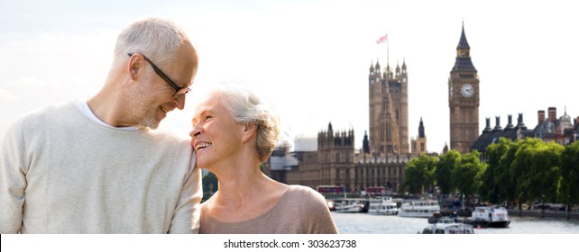 Family, Age, Tourism, Travel And People Concept - Happy Senior Couple Over Houses Of Parliament And Big Ben Clock Tower In London