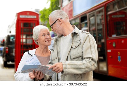 Family, Age, Tourism, Travel And People Concept - Senior Couple With Map Over London City Street Background