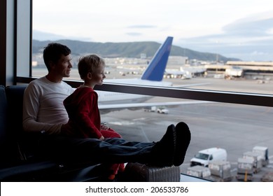 Family At The Airport Waiting For Departure