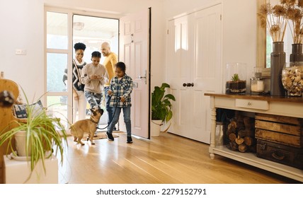 Family arriving home, boy with Down syndrome with dog - Powered by Shutterstock