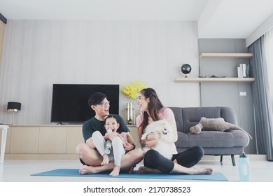family Asian with daughter playing at home and family weekends. Happy family in the living room at home funny activities. - Shutterstock ID 2170738523