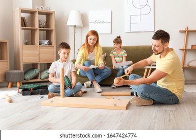 Family Assembling Furniture At Home