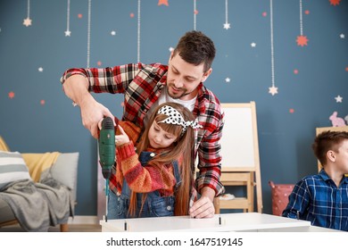 Family Assembling Furniture At Home