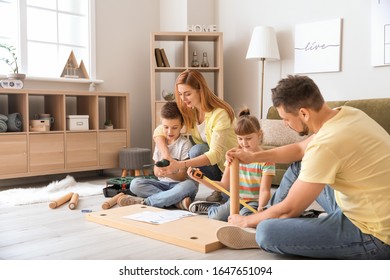 Family Assembling Furniture At Home