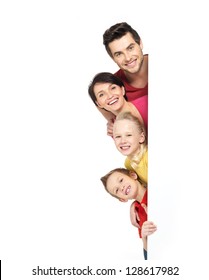 Family with a banner smiling - isolated on a white background