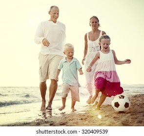 Family Beach Football Holiday Soccer Togetherness Concept