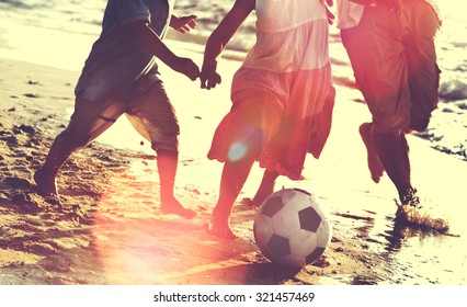 Family Beach Football Holiday Soccer Togetherness Concept