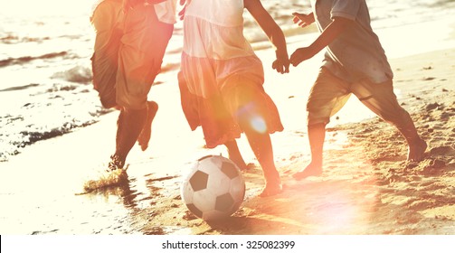 Family Beach Football Holiday Soccer Togetherness Concept