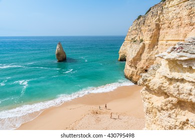 Family At Beautiful Beach Carvalho Of Algarve, Portugal