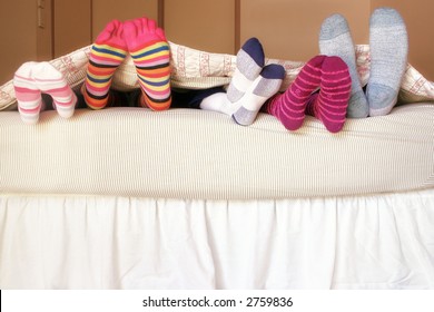 Family Bed:  The Kids Climb Into Bed On A Weekend Morning To Snuggle Up With Mom And Dad.