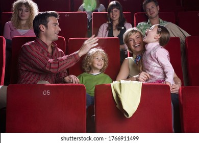 Family Being Silly In Movie Theater