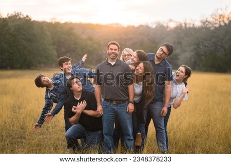a family being silly outside together 