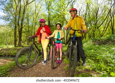 Family Bike Trip In The Sunny Spring Park