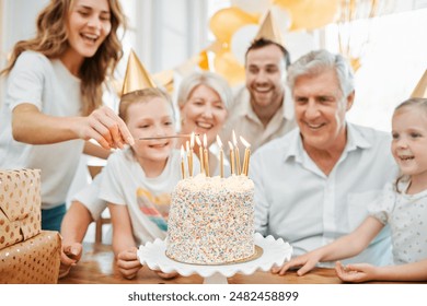 Family, birthday and celebration in home with cake, lighting candles and express gratitude. Happy people, grandmother and parents with children for grandfather party, growth and dessert on table - Powered by Shutterstock