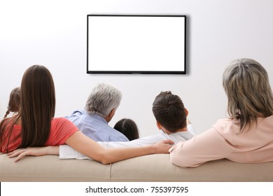 Family And Blank TV Display At Home