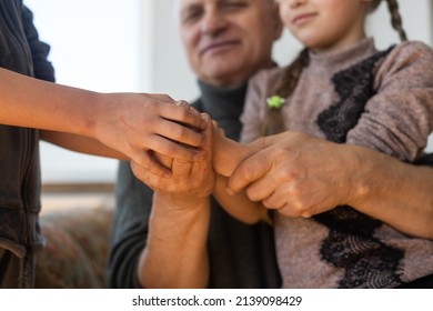 Family bonding. grandfather and child holding hands together, closeup view. Panorama