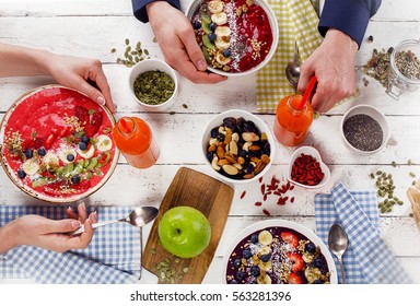 Family Breakfast With Berries Smoothies And Superfood On A White Wooden Table. Healthy Eating Concept. Top View