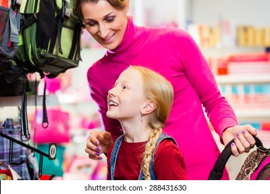 Family Buying School Satchel Or Bag In Store Preparing For First Day In School