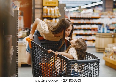 The family buys groceries at the supermarket