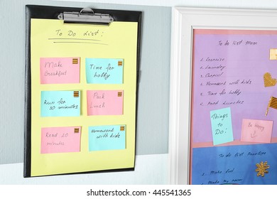 Family Calendar On Stylish Wall. To Do List Concept