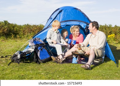 Family Camping With Tent And Cooking