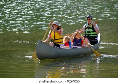 Family In A Canoe On A Lake