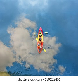 Family In A Canoe On The River