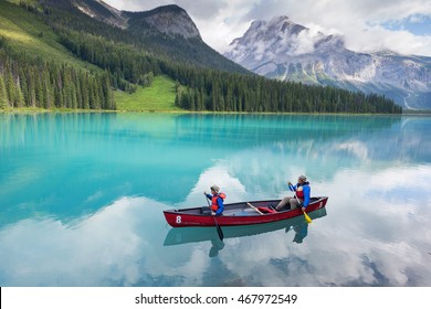 Family Canoeing On Emerald Lake 