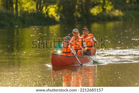 Family Canoeing on a river in bavaria germany
