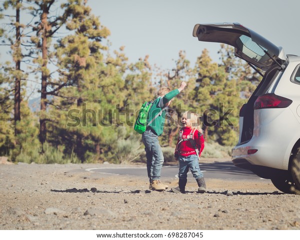 family car travel - happy little boy and girl get
ready for hiking