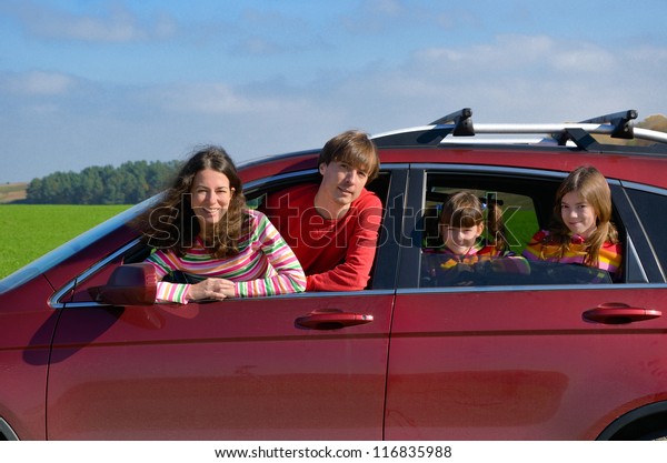 Family car trip on\
vacation, happy parents travel with kids and having fun. Car\
insurance and holiday\
concept