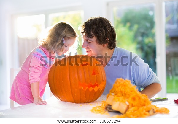 Family Carving Pumpkin Halloween Parents Children Royalty Free