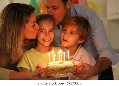 Family Celebrating Child's Birthday