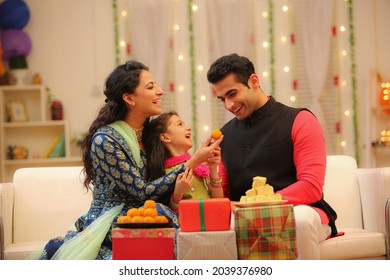 Family celebrating diwali at home with full of happiness