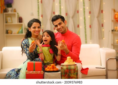 Family celebrating diwali at home with full of happiness