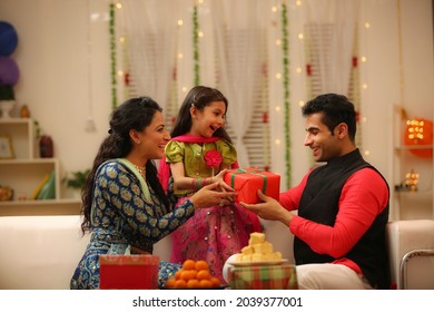 Family celebrating diwali at home with full of happiness