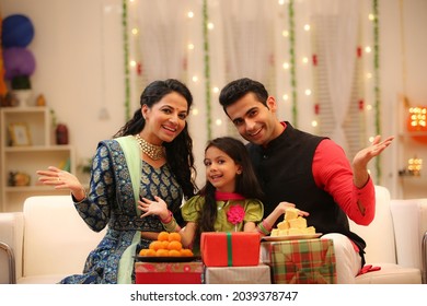 family celebrating diwali at home with full of happiness - Powered by Shutterstock
